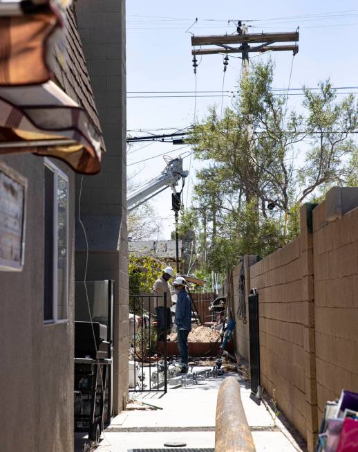 NV Energy workers repair power line knocked down by high wind causing a house water heater to e ...