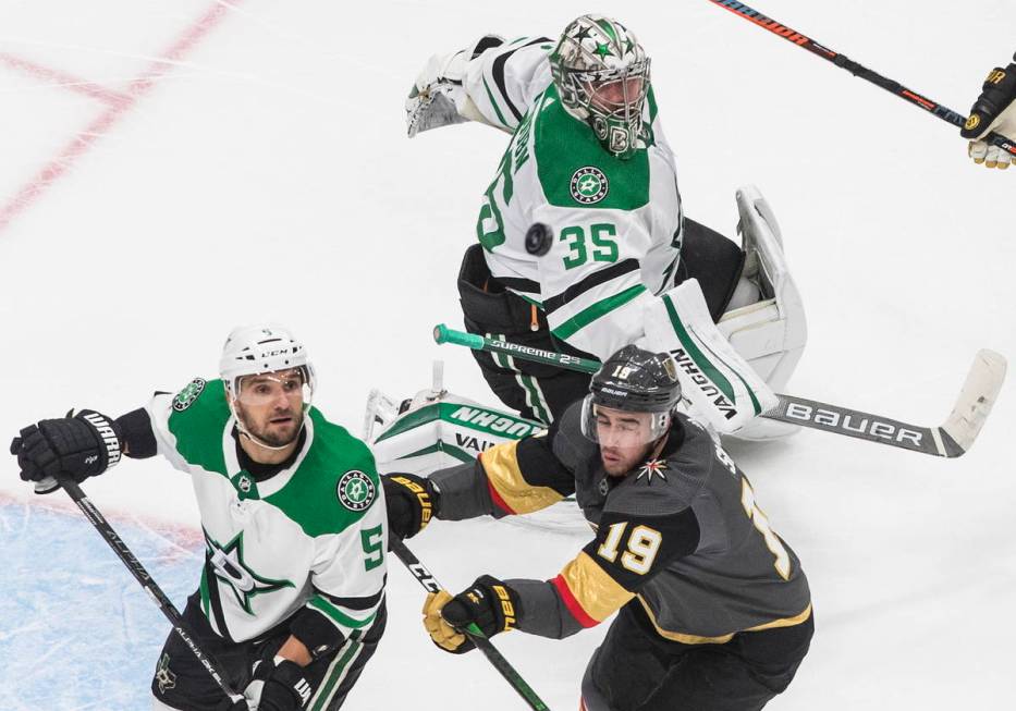 Dallas Stars goalie Anton Khudobin (35) and teammate Andrej Sekera (5) and Vegas Golden Knights ...