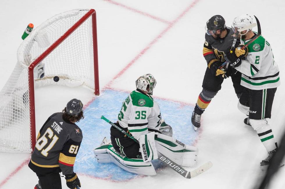 Dallas Stars goalie Anton Khudobin (35) gives up a goal as Vegas Golden Knights' Mark Stone (61 ...