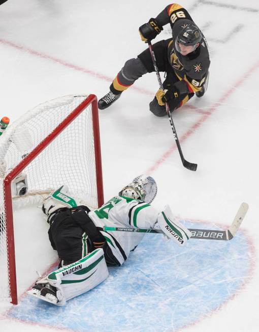 Dallas Stars goalie Anton Khudobin (35) gives up a goal as Vegas Golden Knights' Tomas Nosek wa ...