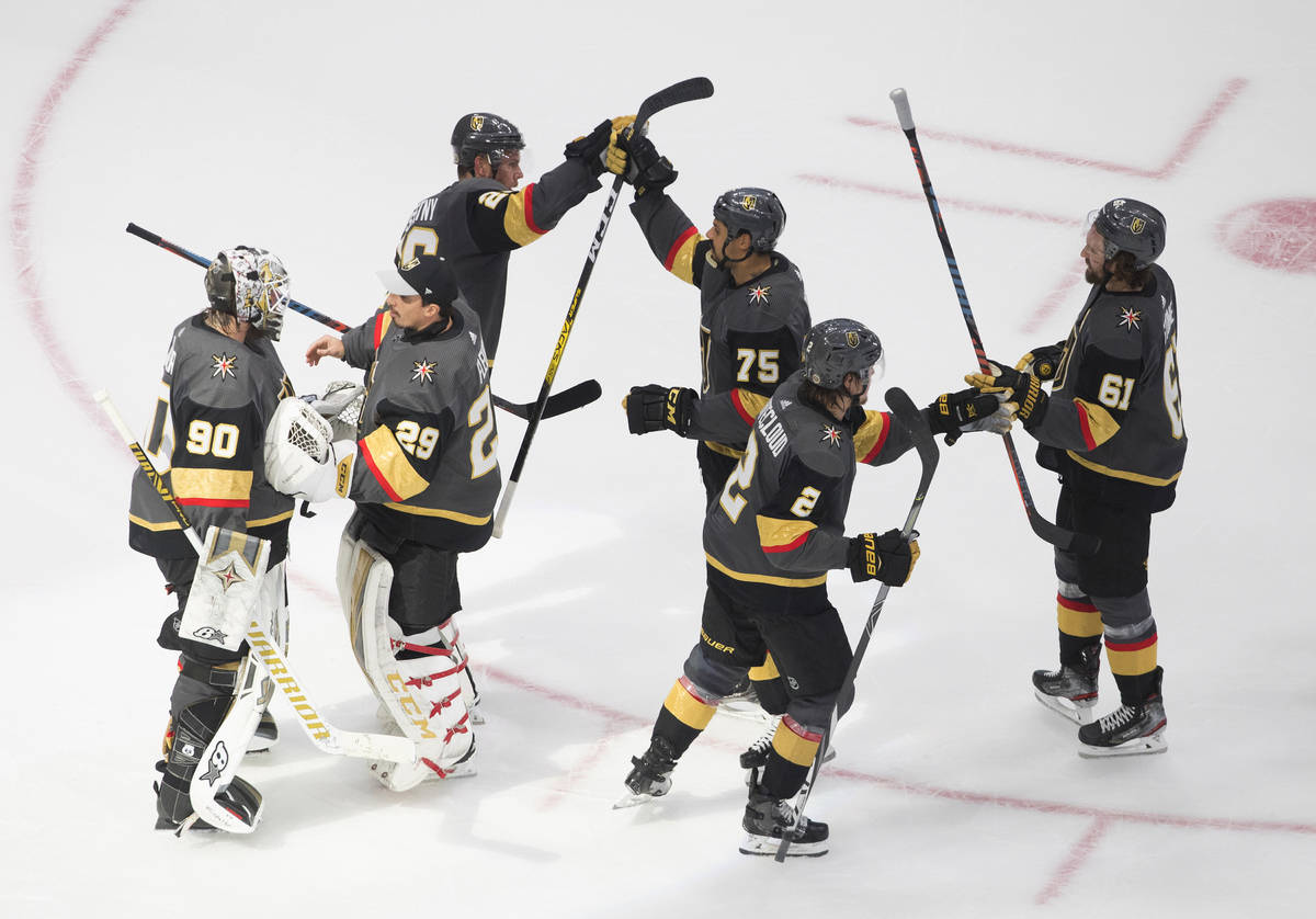 Vegas Golden Knights celebrate a 3-0 win over the Dallas Stars in Game 2 of the NHL hockey West ...