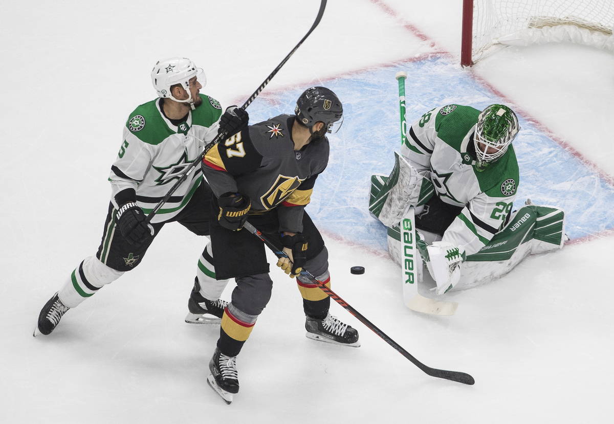Dallas Stars goalie Jake Oettinger (29) makes a save on Vegas Golden Knights' Max Pacioretty (6 ...