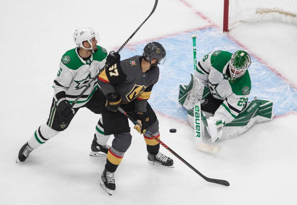 Dallas Stars goalie Jake Oettinger (29) makes a save on Vegas Golden Knights' Max Pacioretty (6 ...