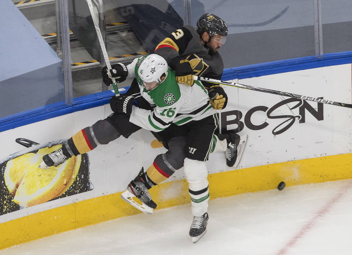 Dallas Stars' Joe Pavelski (16) checks Vegas Golden Knights' Alec Martinez (23) during the thir ...