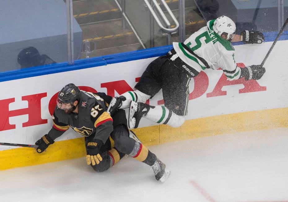 Dallas Stars' Andrej Sekera (5) checks Vegas Golden Knights' Max Pacioretty (67) during the thi ...