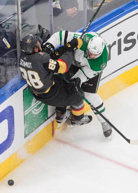 Dallas Stars' Radek Faksa (12) checks Vegas Golden Knights' Nate Schmidt (88) during the third ...