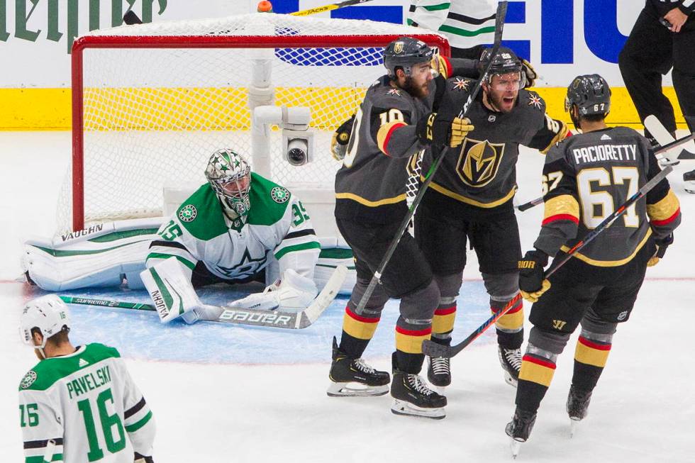 Dallas Stars goalie Anton Khudobin (35) watches as Vegas Golden Knights' Nicolas Roy (10), Paul ...