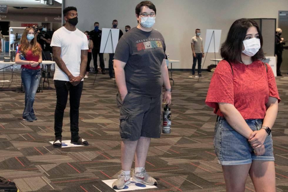 In this Aug. 10, 2020, file photo, volunteers, including Jasmine Barrett, right, and Sergio Bu ...