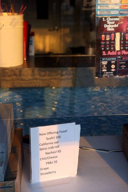 A sign advertising food options inside the closed Fat Tuesday at Casino Royale on the Strip in ...