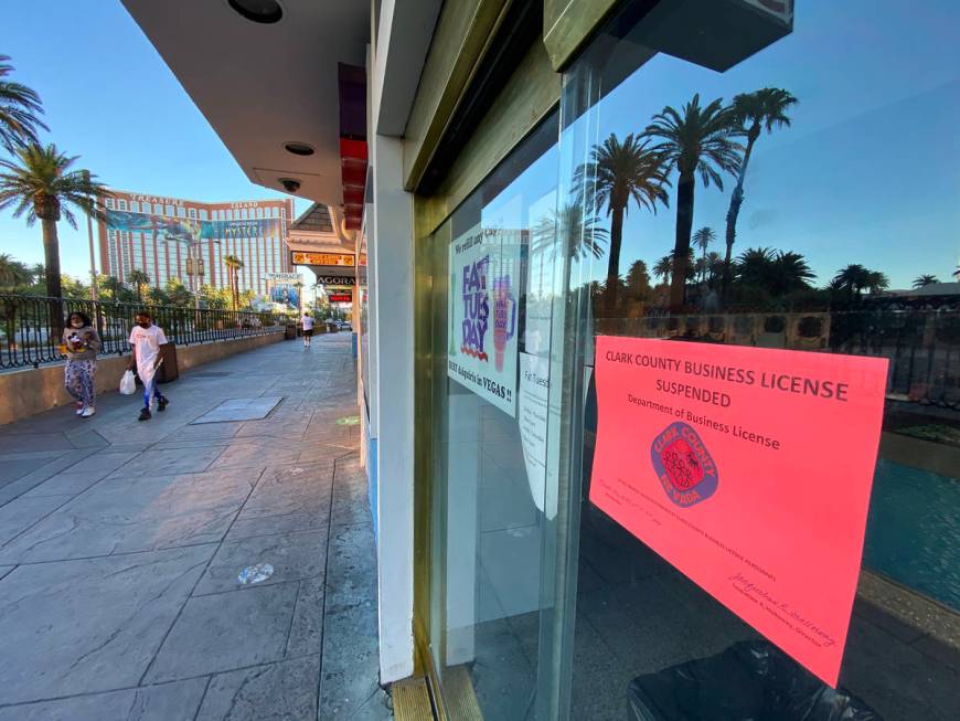 A Clark County sign states that the business license has been suspended at Fat Tuesday at Casin ...