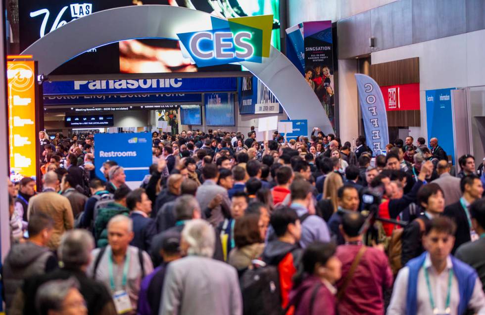Attendees gather outside of the main entrance for Central Hall as CES Day 1 is about to open at ...