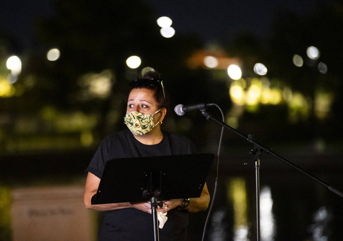 Jeanne Llera, mother of Jorge Gomez, speaks during a candlelight vigil in his memory at Lorenzi ...
