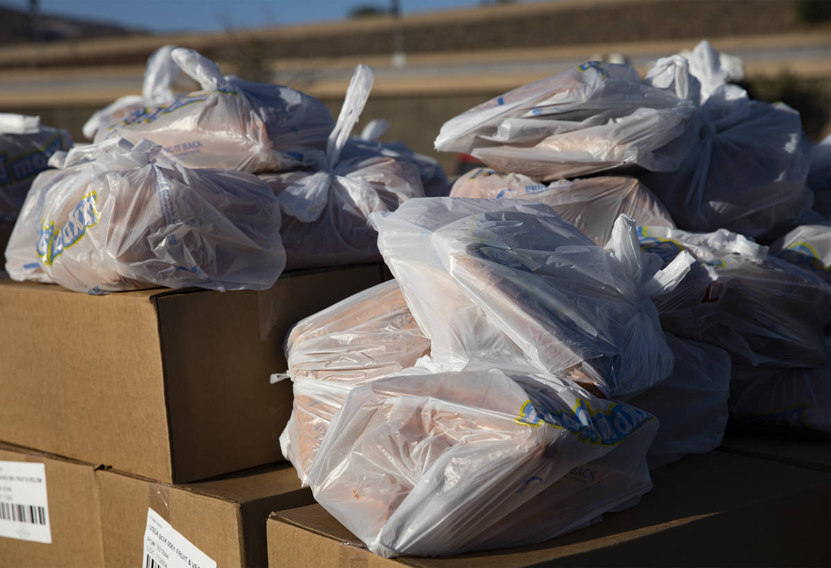 Bags of food to be given away at the new drive-thru distribution site for Three Square, Souther ...