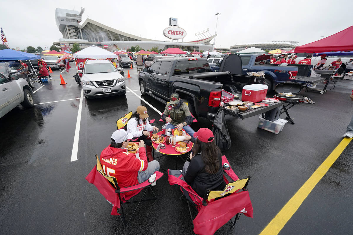 Fans tailgate outside Arrowhead Stadium before an NFL football game between the Kansas City Chi ...