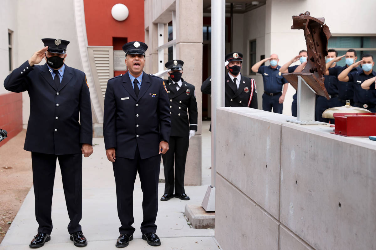 Retired New York firefighter Frank Pizarro, of Las Vegas, second from left, sings during a 9/11 ...