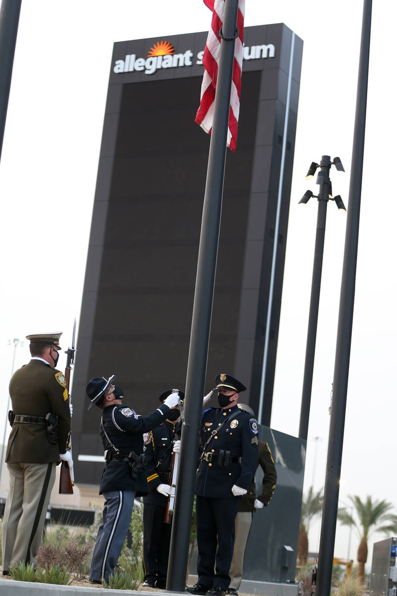 A multi-agency honor guard present the colors during a 9/11 ceremony at Allegiant Stadium in La ...