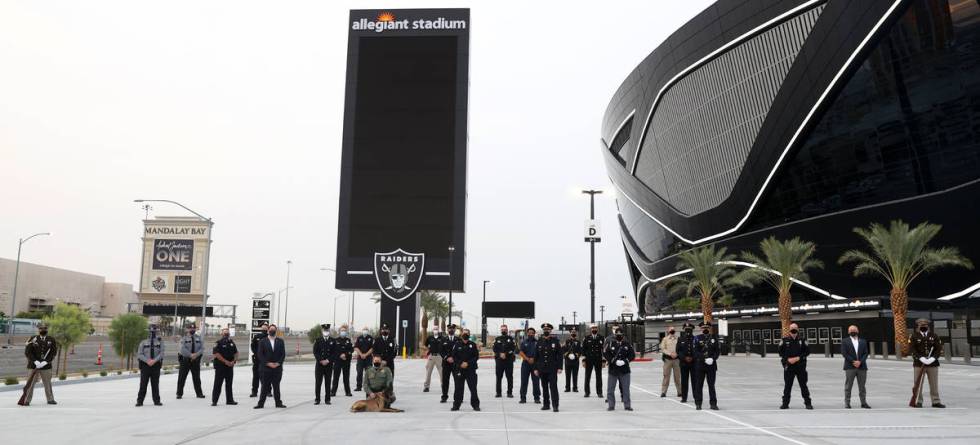 Multi-agency emergency responders are photographed during a 9/11 ceremony at Allegiant Stadium ...