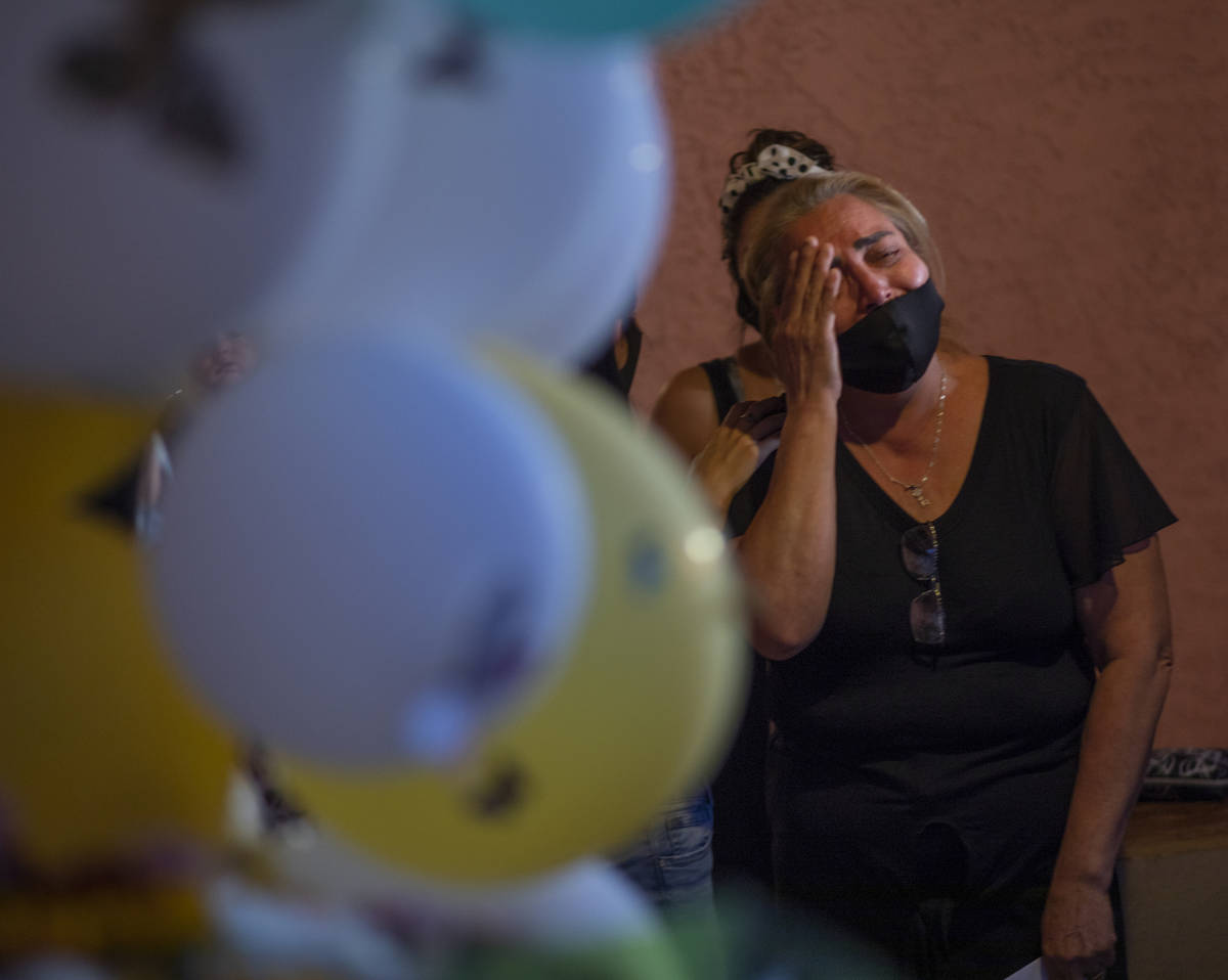 Mother of victim Lesly Palacio, Aracely Palacio, mourns her daughter during a vigil, at their h ...