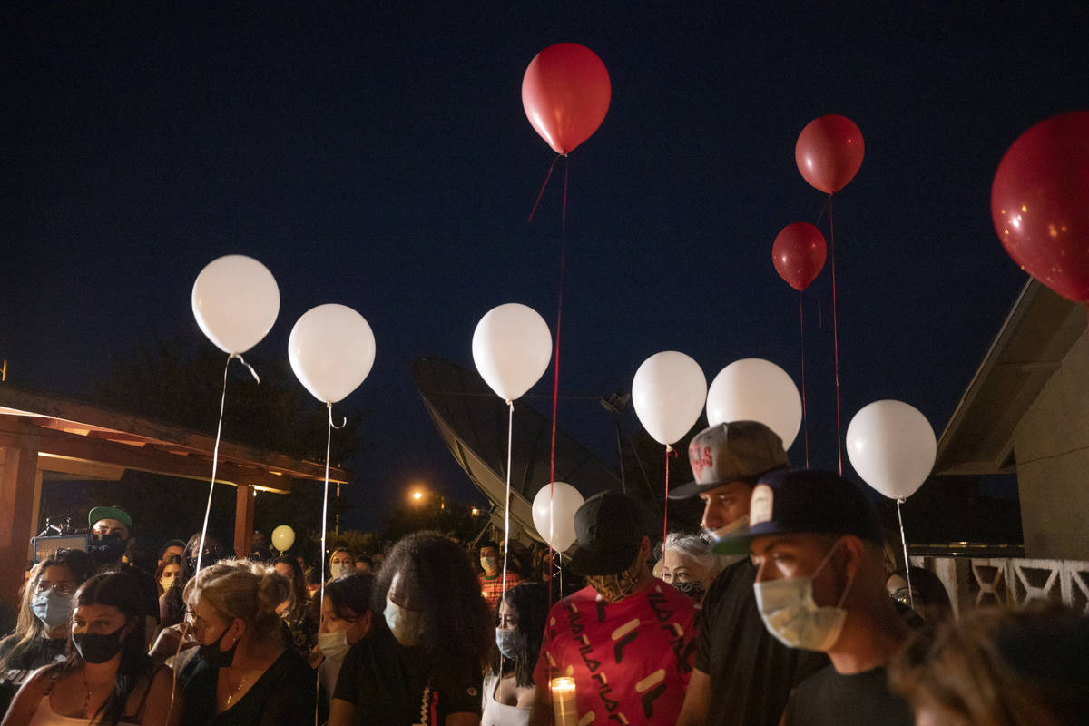 Family members and friends mourn Lesly Palacio, 22, during a vigil at her mother's home in Las ...