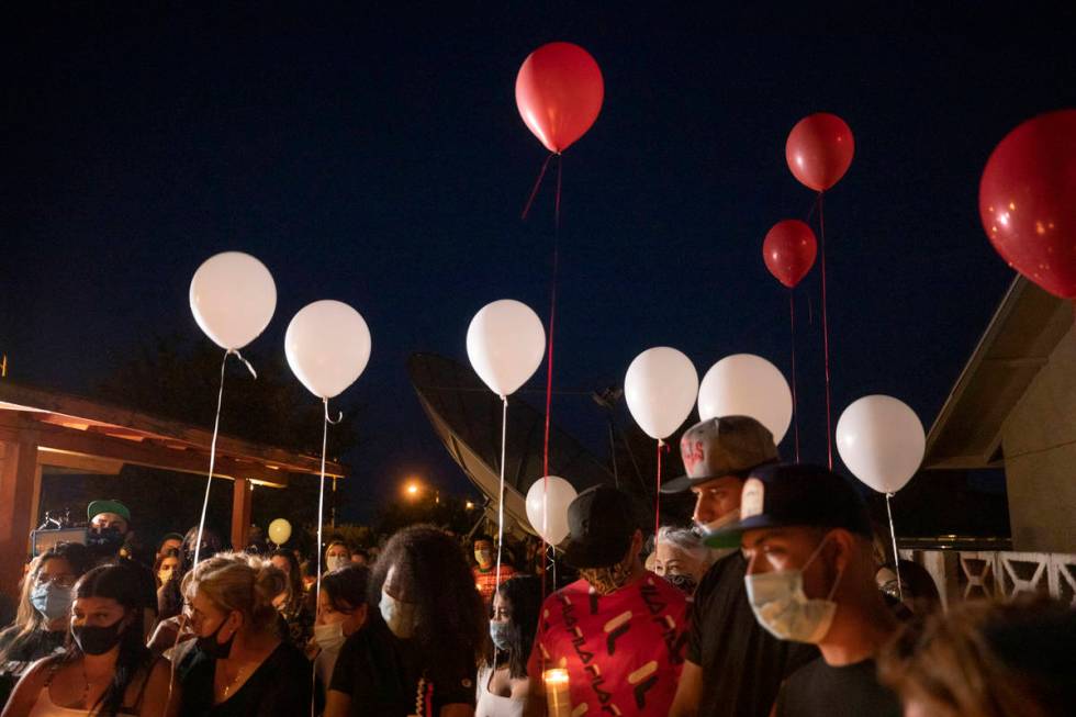 Family members and friends mourn Lesly Palacio, 22, during a vigil at her mother's home in Las ...