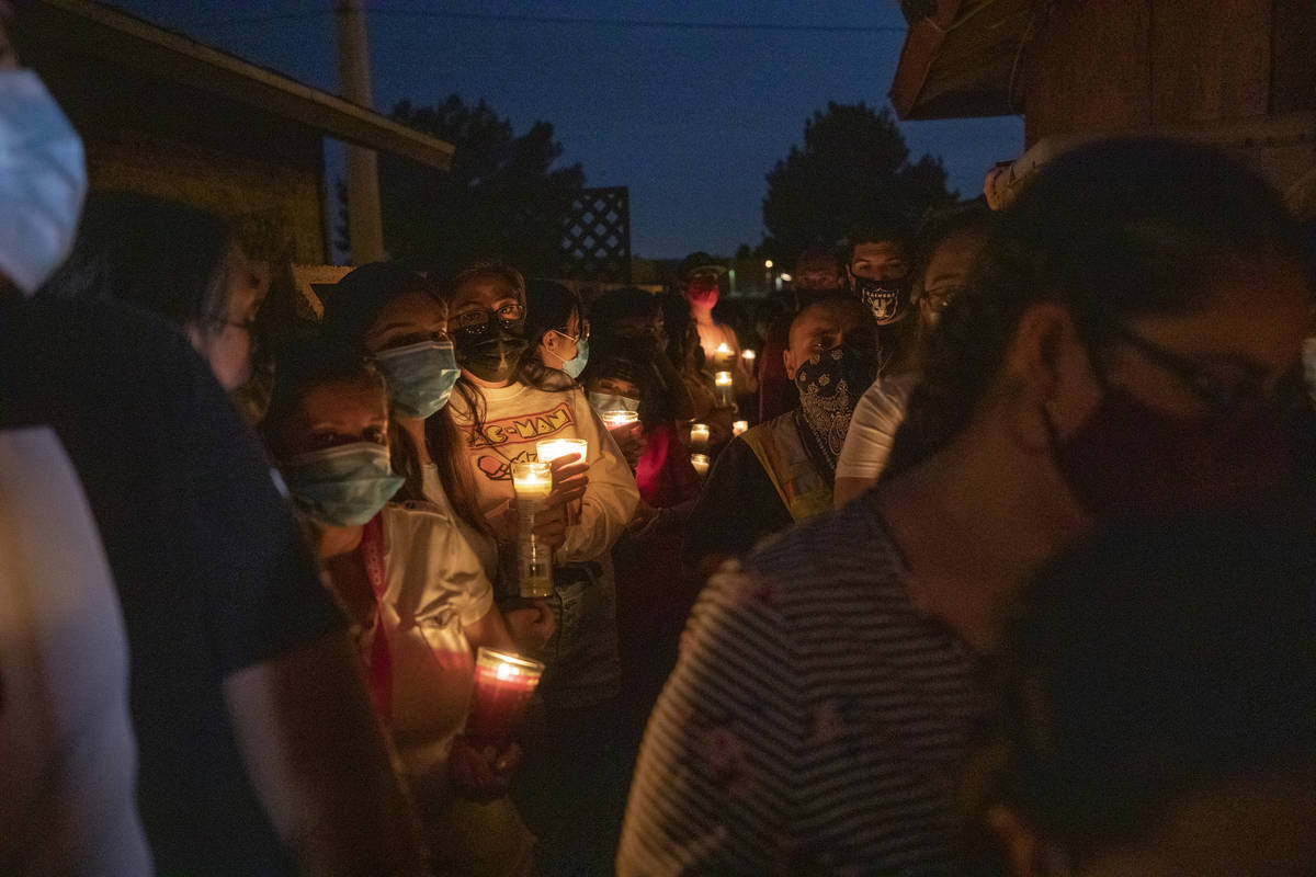 Family members and friends mourn victim Lesly Palacio, 22, during a vigil at her motherճ home ...