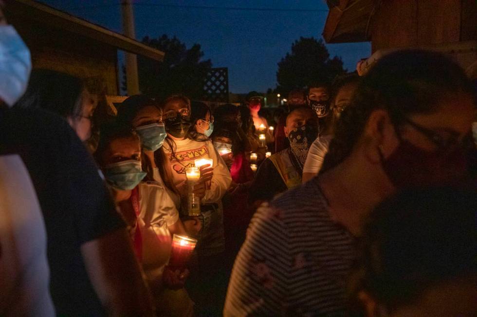Family members and friends mourn victim Lesly Palacio, 22, during a vigil at her motherճ home ...
