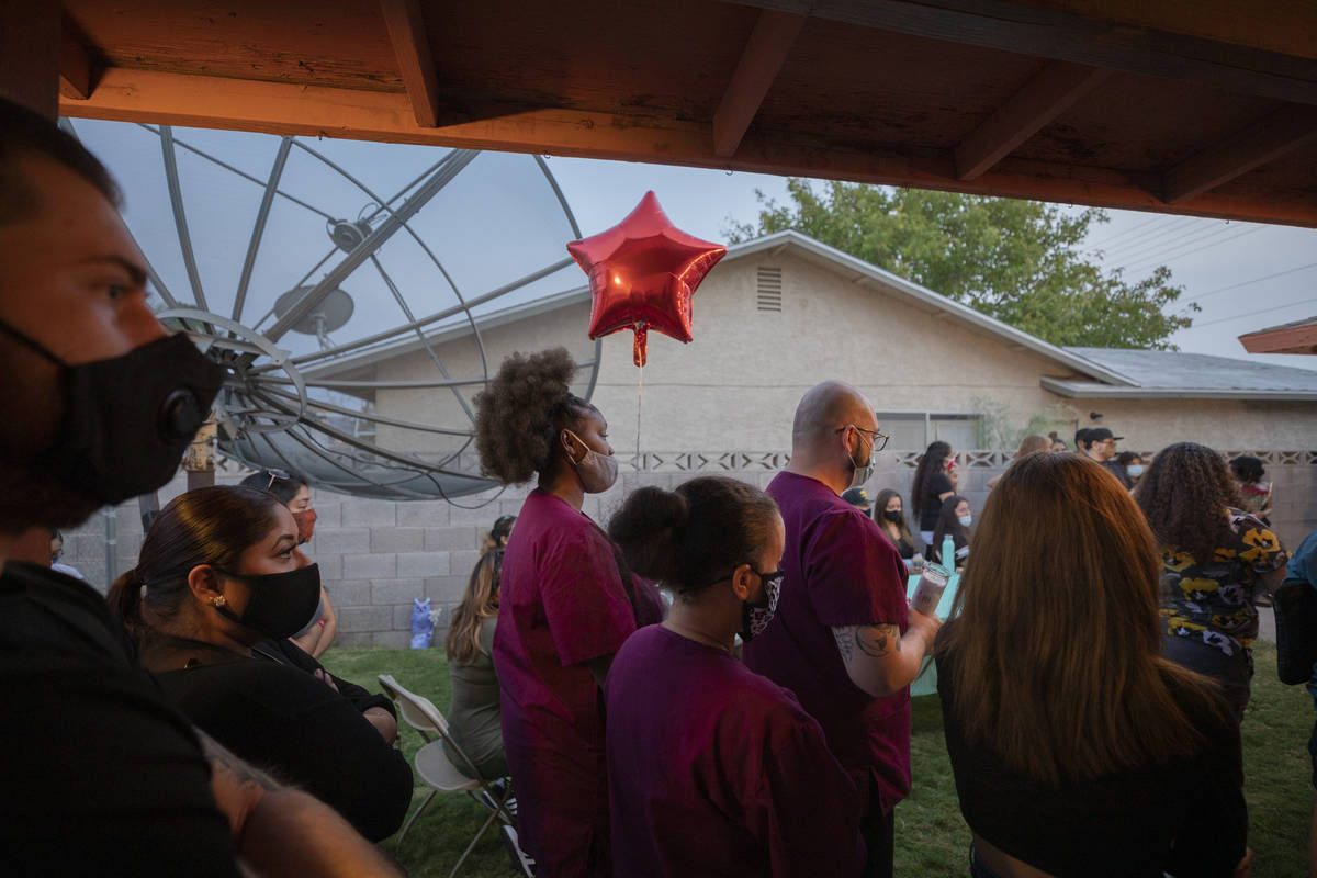 Classmates and friends mourn victim Lesly Palacio, 22, during a vigil at her mother's home in L ...