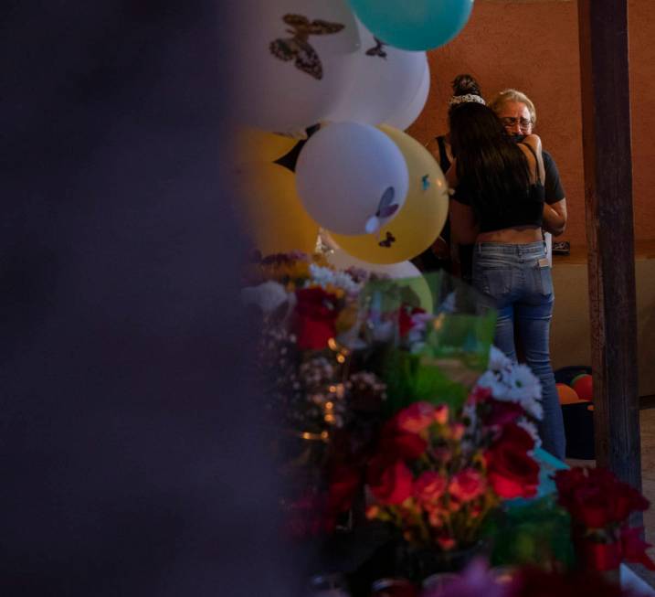 Mother of murder victim Lesly Palacio, Aracely Palacio, right, is comforted during a vigil for ...