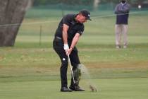 Phil Mickelson hits his approach shot to the 18th green of the Silverado Resort North Course du ...