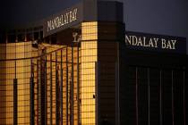 Broken windows are seen at Mandalay Bay on the Las Vegas Strip following a mass shooting at a m ...