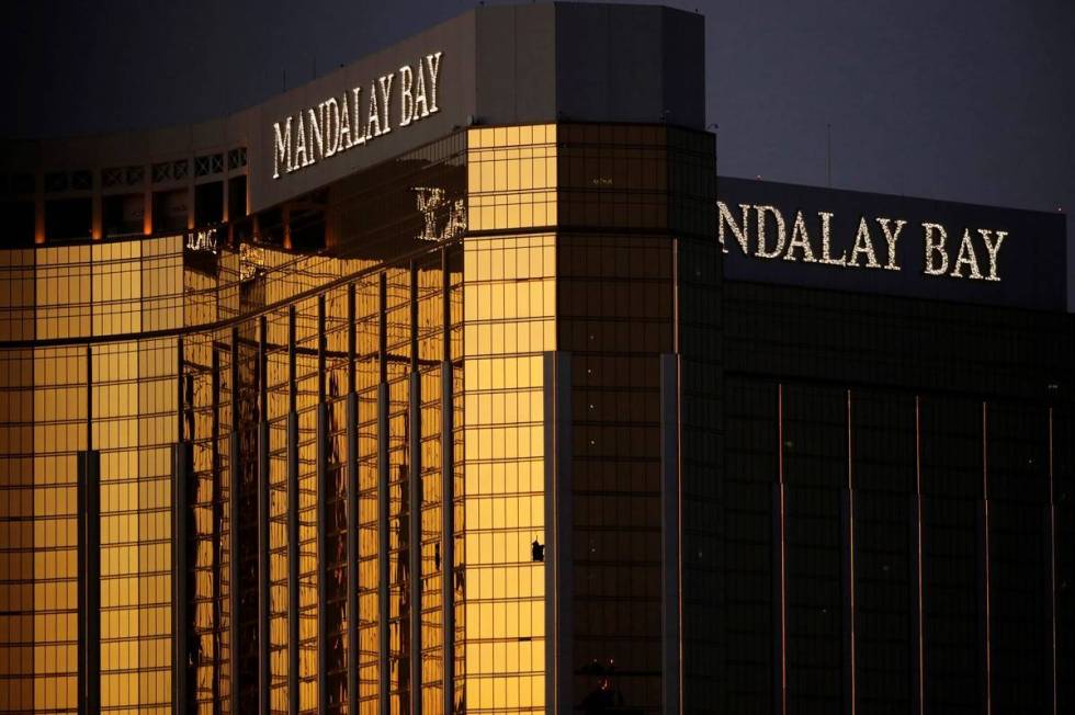Broken windows are seen at Mandalay Bay on the Las Vegas Strip following a mass shooting at a m ...