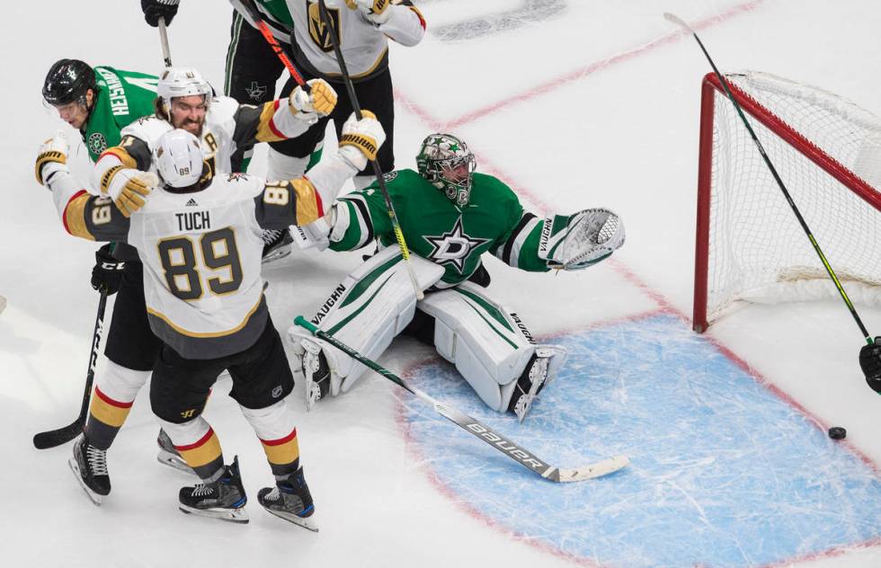 Dallas Stars goalie Anton Khudobin (35) gives up a goal as Vegas Golden Knights' Mark Stone (61 ...