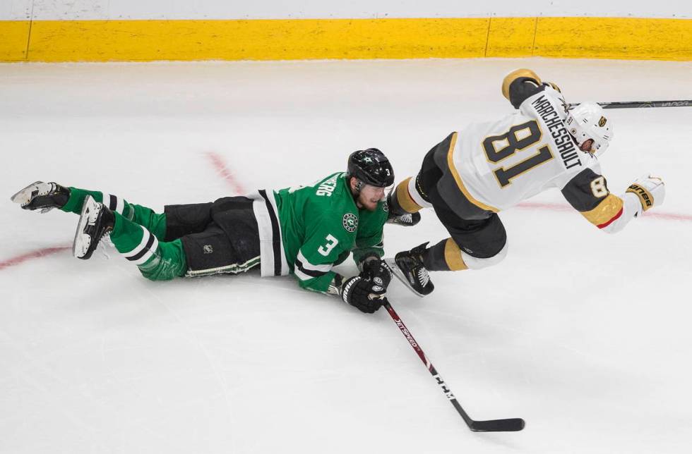 Dallas Stars' John Klingberg (3) trips Vegas Golden Knights' Jonathan Marchessault (81) during ...