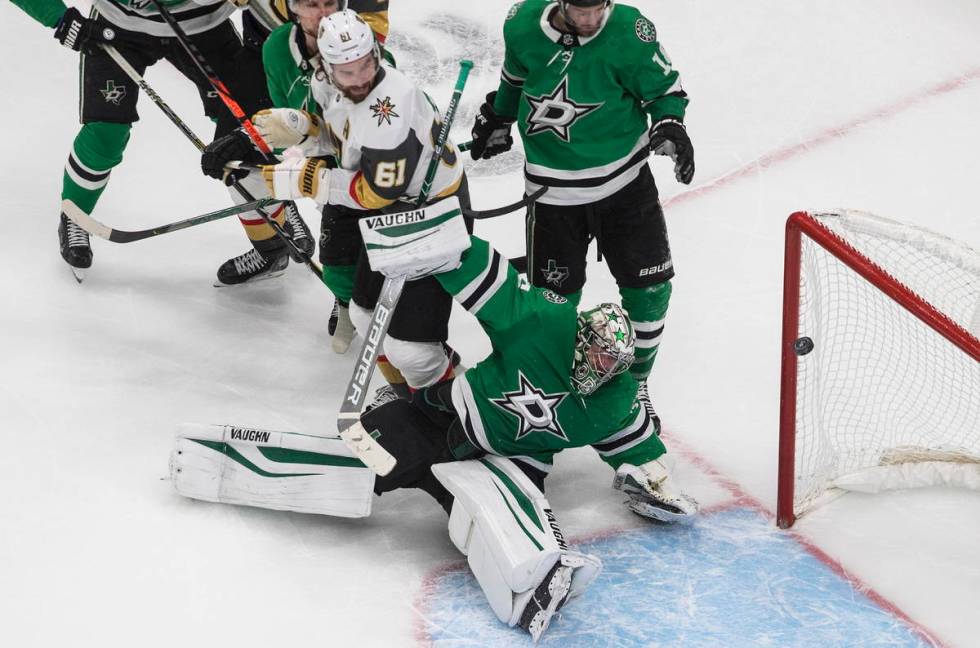 Dallas Stars goalie Anton Khudobin (35) gives up a goal as Vegas Golden Knights' Mark Stone (61 ...