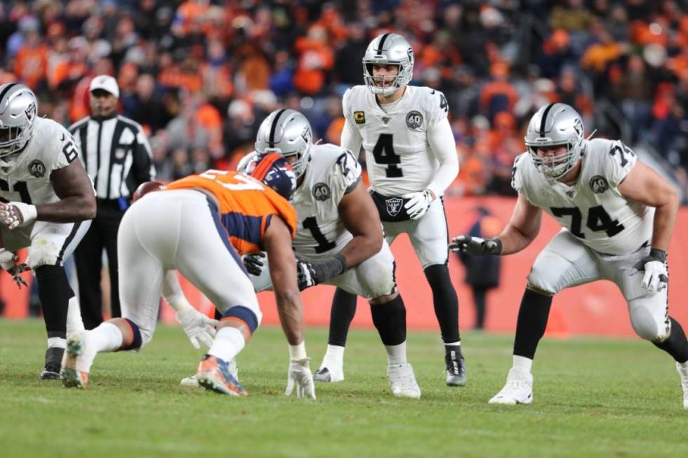 Oakland Raiders quarterback Derek Carr (4) sets up behind his offensive linemen Rodney Hudson ( ...