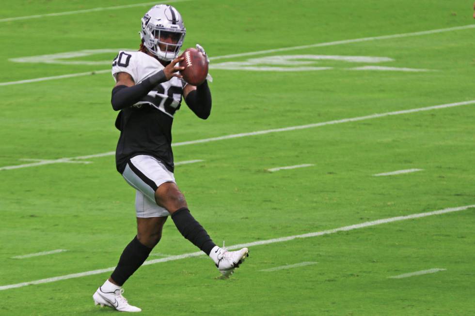 Las Vegas Raiders cornerback Damon Arnette (20) catches a ball during a team practice at Allegi ...