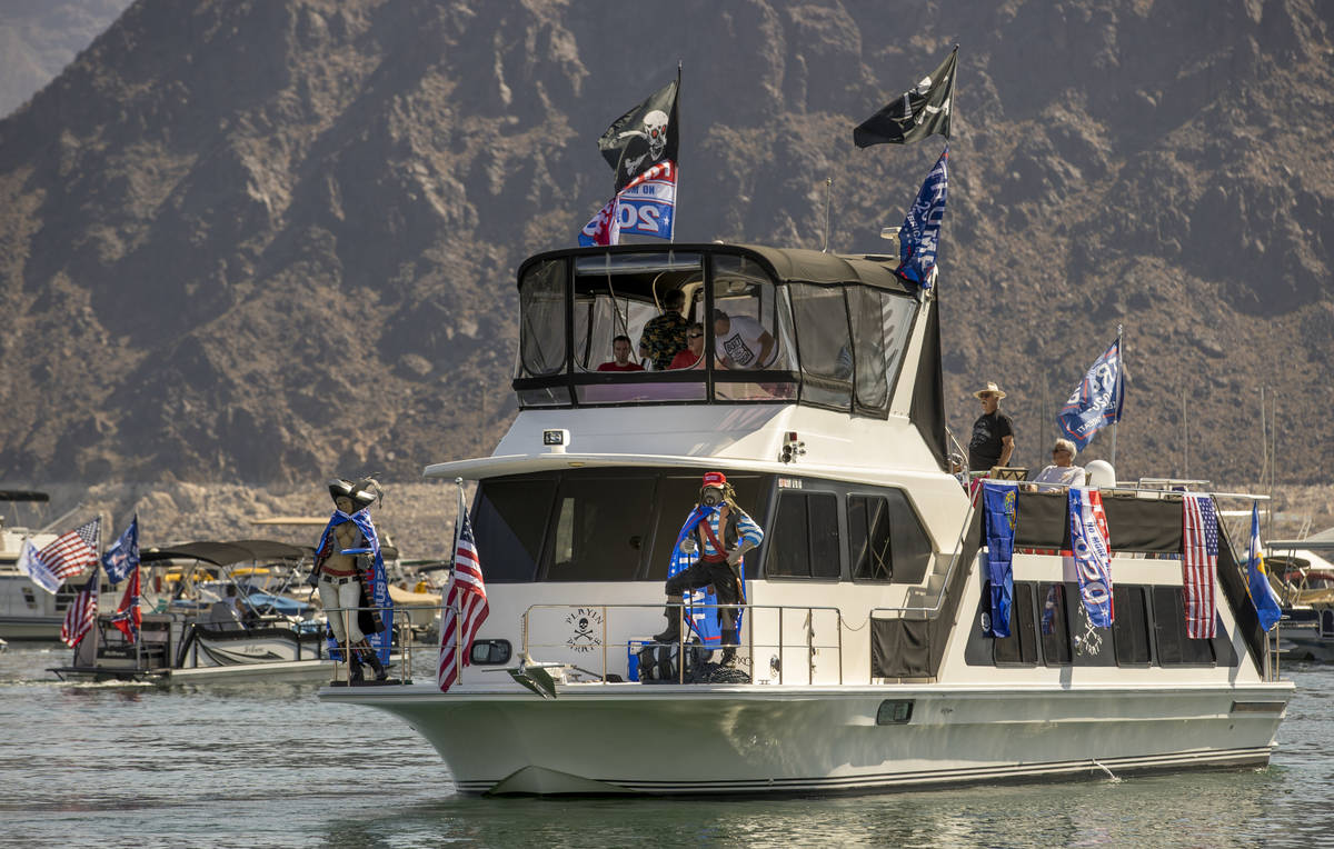 A decked out boat leaves the harbor for the President Donald Trump boat parade at the Lake Mead ...