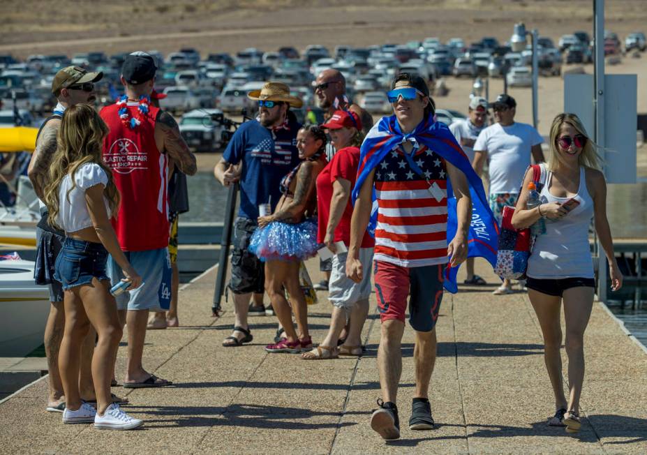 Robert Wyson, center, and Jessica Pappas arrive on the dock with others to take in preparations ...