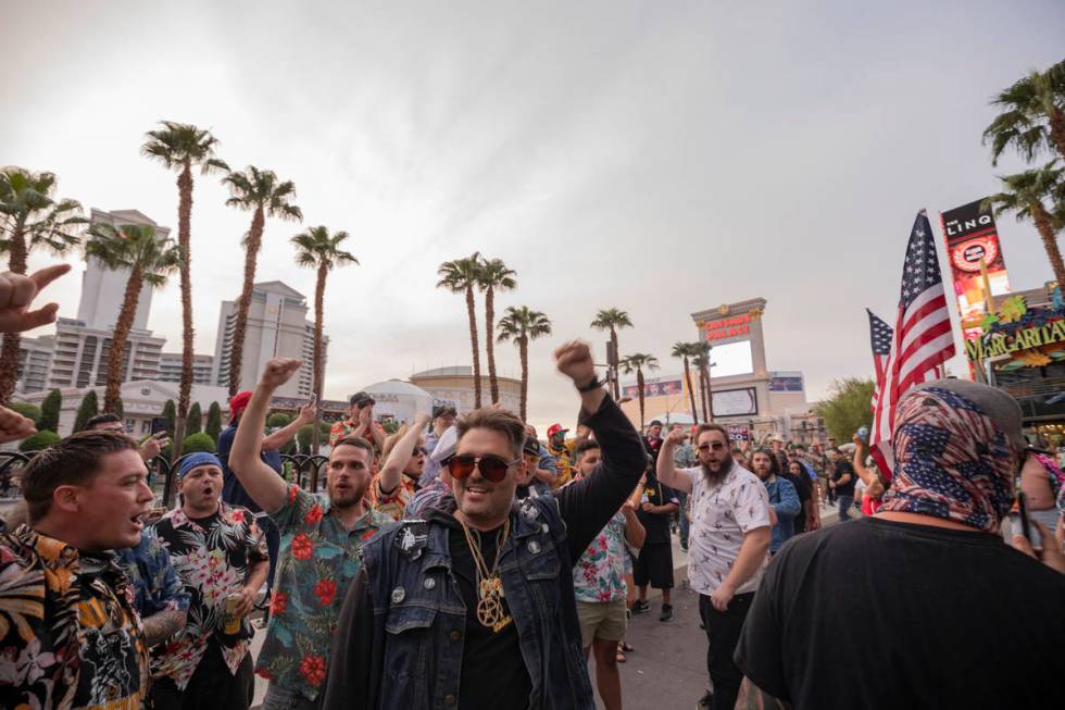 Individuals chant “Four more years,” on the Las Vegas Strip on Friday, Sept. 11, 2020. (Eli ...