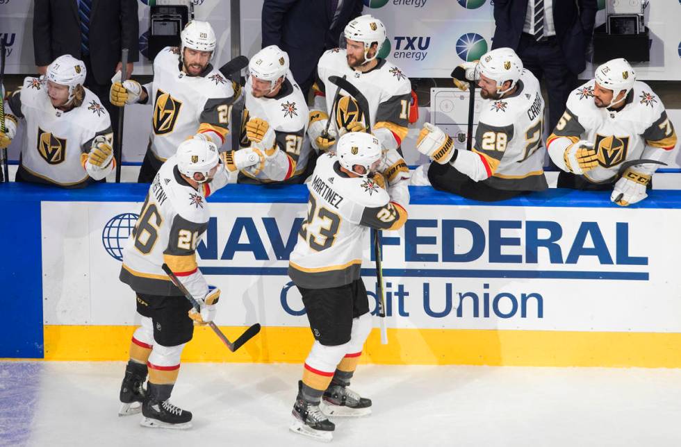 Vegas Golden Knights' Paul Stastny (26) and Alec Martinez (23) celebrate a goal against the Dal ...