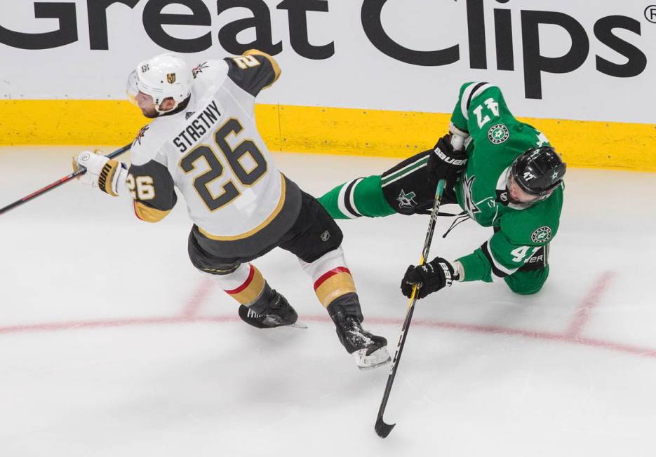 Dallas Stars right wing Alexander Radulov (47) is checked by Vegas Golden Knights centre Paul S ...