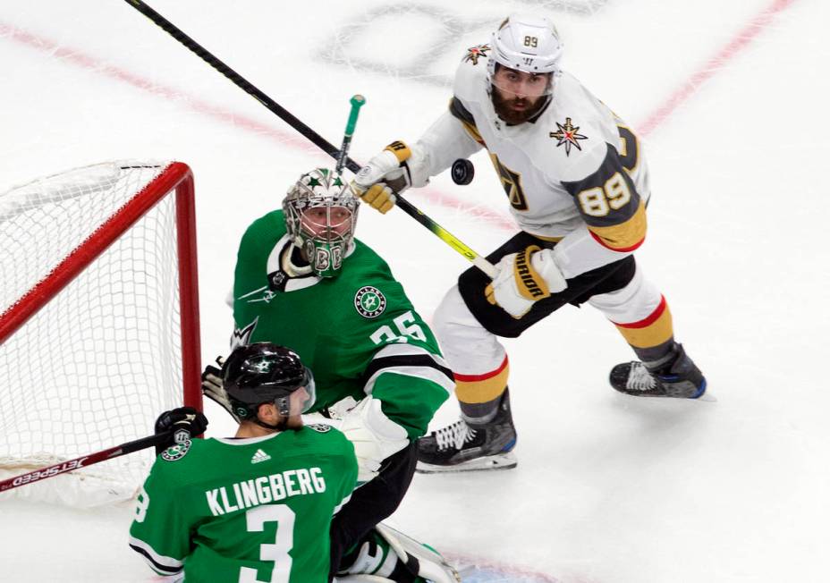 Dallas Stars goalie Anton Khudobin (35), Stars' John Klingberg (3) and Vegas Golden Knights' Al ...