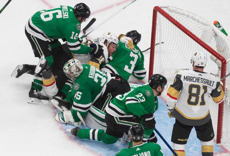 Dallas Stars goalie Anton Khudobin (35) makes a save against the Vegas Golden Knights as player ...