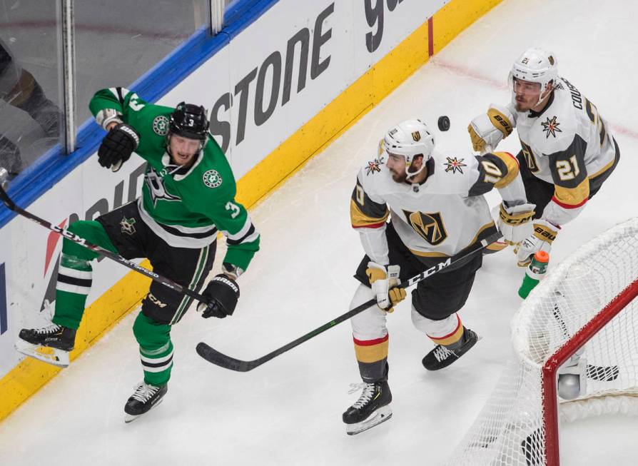 Dallas Stars' John Klingberg (3) and Vegas Golden Knights' Nicolas Roy (10) and Nick Cousins (2 ...