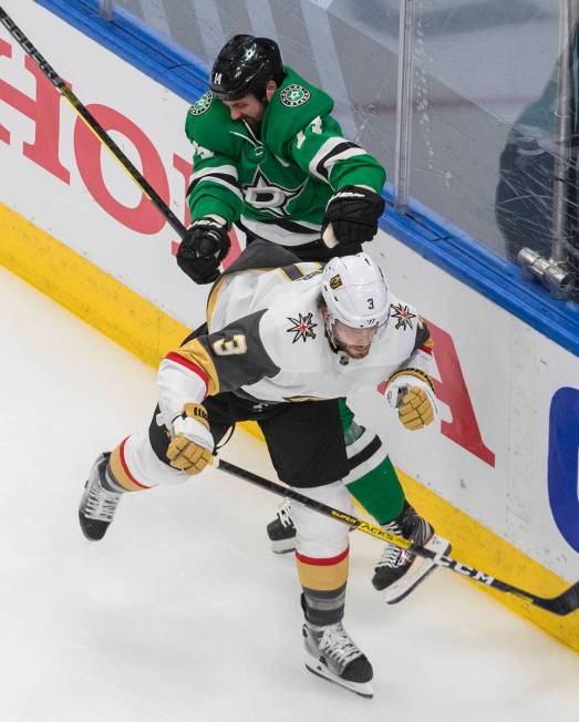 Dallas Stars' Jamie Benn (14) checks Vegas Golden Knights' Brayden McNabb (3) during the second ...