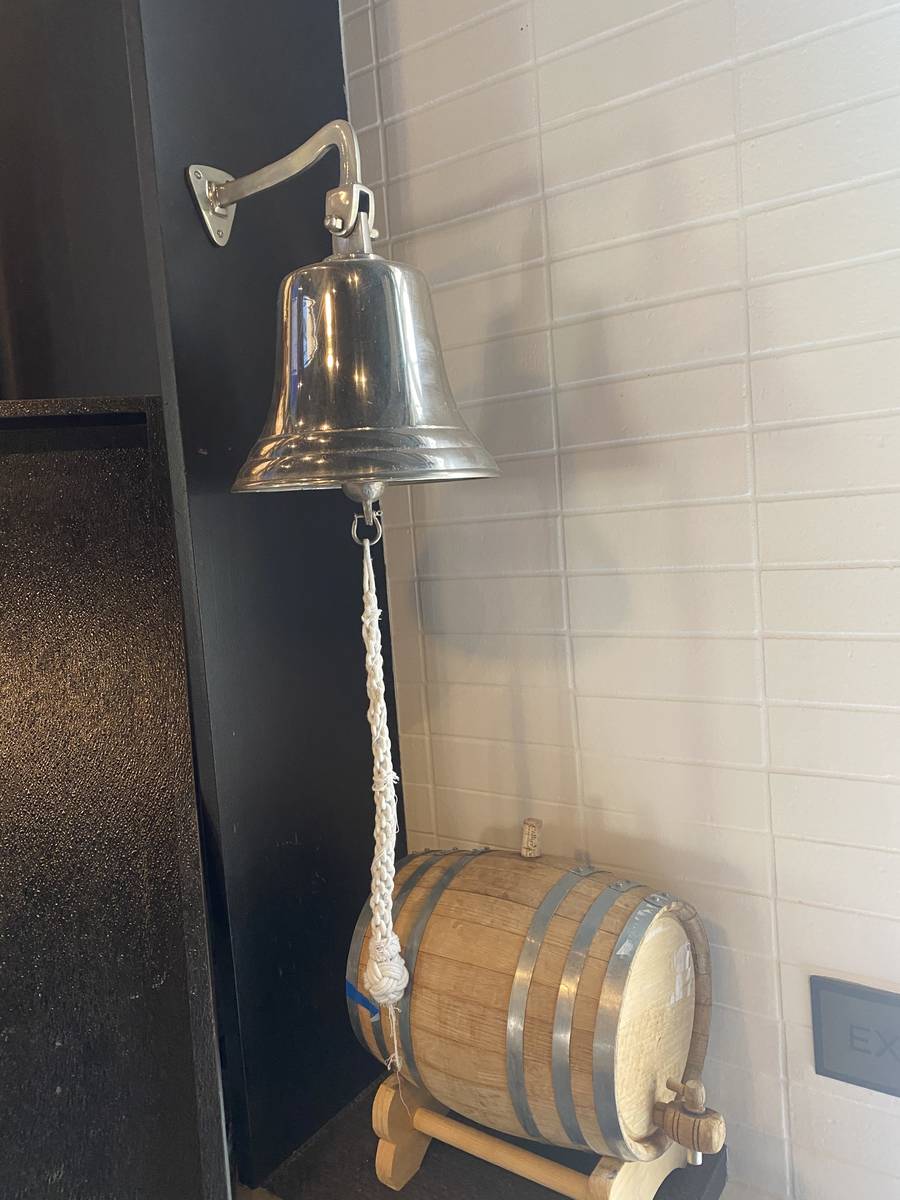 A bell that rings after every Vegas Golden Knights goal is shown at Wolfgang Puck's Players Loc ...