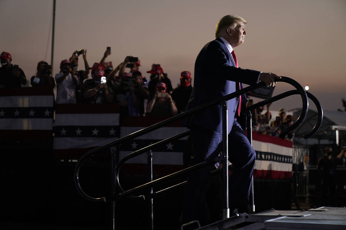 President Donald Trump arrives to speak at a rally at Minden-Tahoe Airport in Minden, Nev., Sat ...