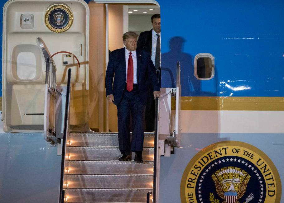 President Donald Trump arrives at McCarran International Airport a begins to deplane from Air F ...