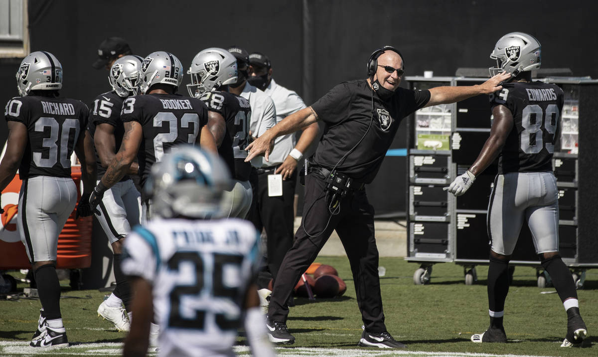 Raiders offensive coordinator Tom Cable pumps up Las Vegas Raiders wide receiver Bryan Edwards ...