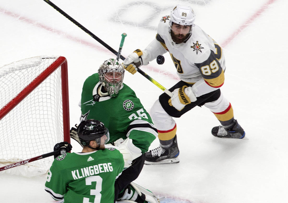 Dallas Stars goalie Anton Khudobin (35), Stars' John Klingberg (3) and Vegas Golden Knights' Al ...